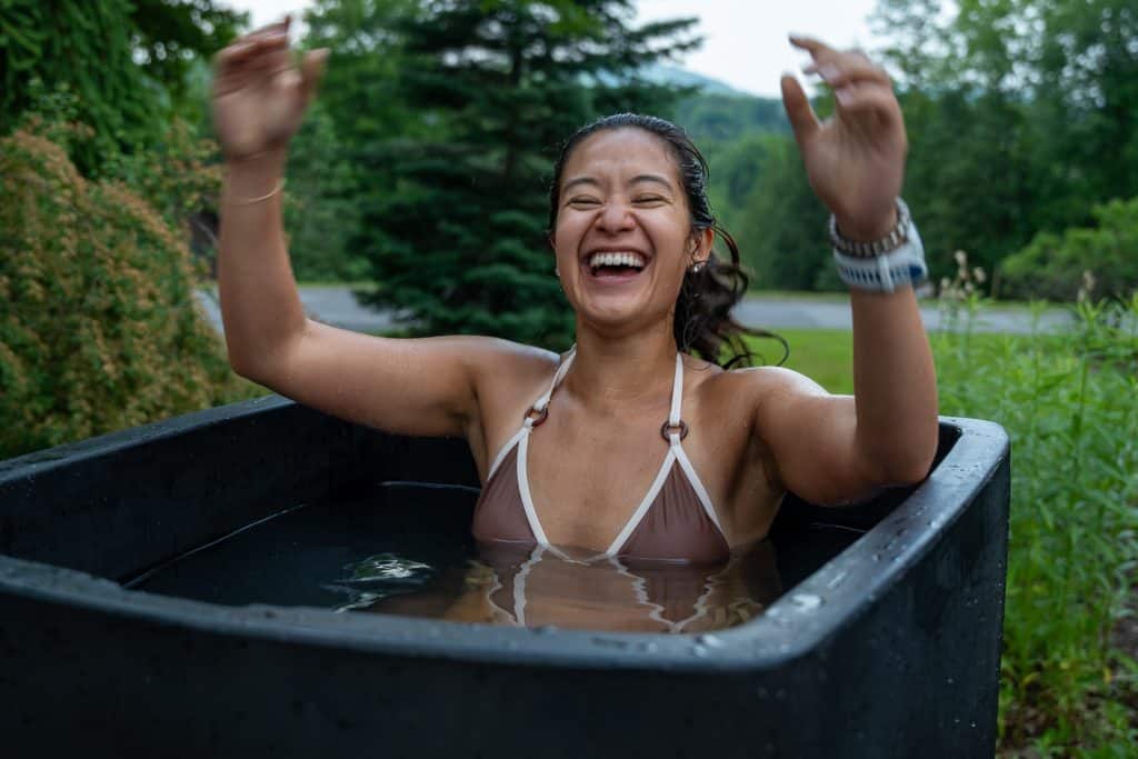 VTLZR retreat athlete laughing in a cold plunge tub