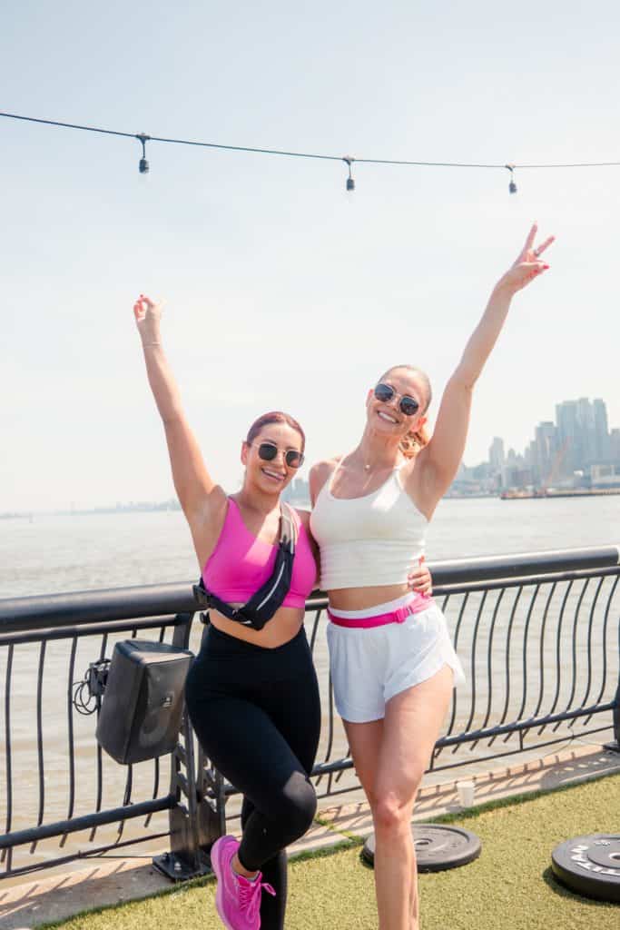 VTLZR members cheering together at the 2025 Jersey City Marathon