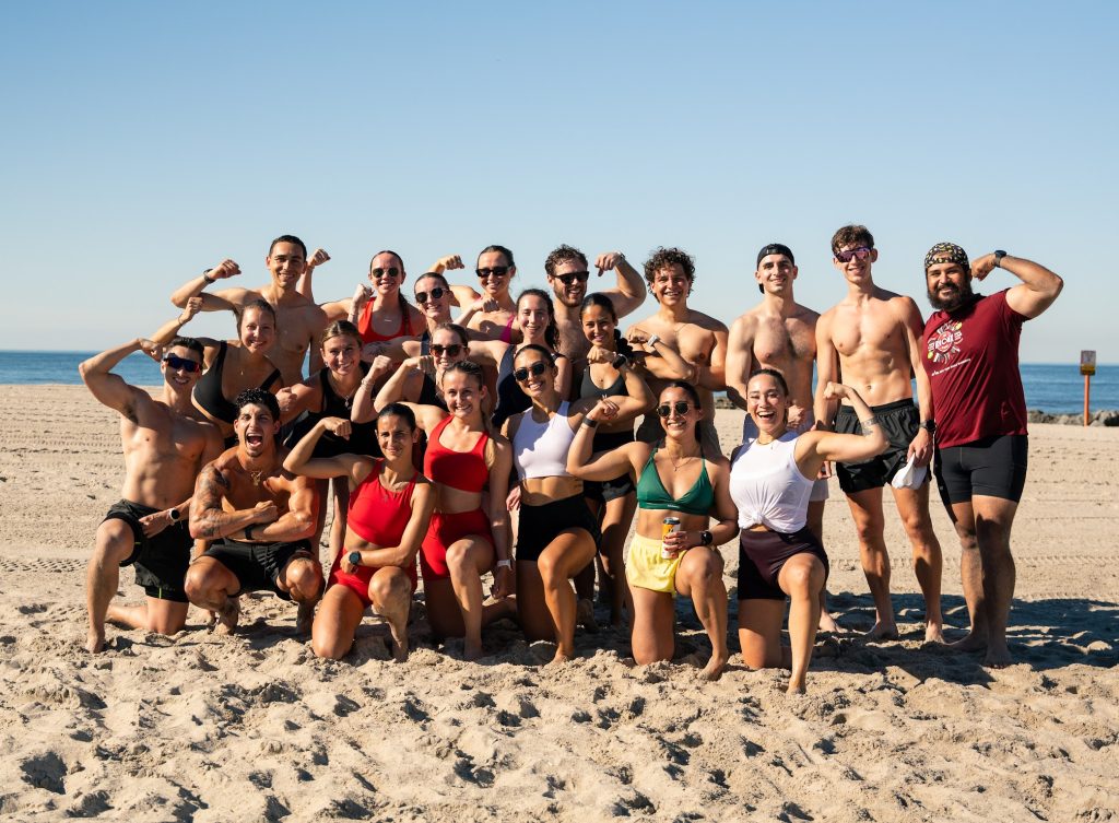 VTLZR community members posing together on the beach